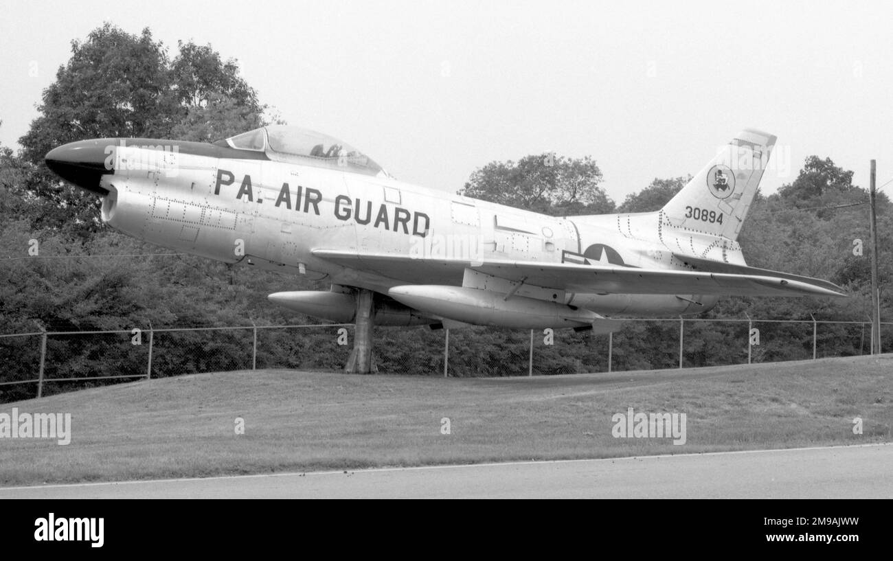 North American F-86L 53-0894 (msn 201-338), mounted on a pylon outside Pennsylvania Air National Guard Base, home of the 171st Air Refuelling Wing, at Pittsburgh International Airport,Pennsylvania. 53-0894 was built as an F-86D-60-NA Sabre and upgraded to F-86L standard. Stock Photo