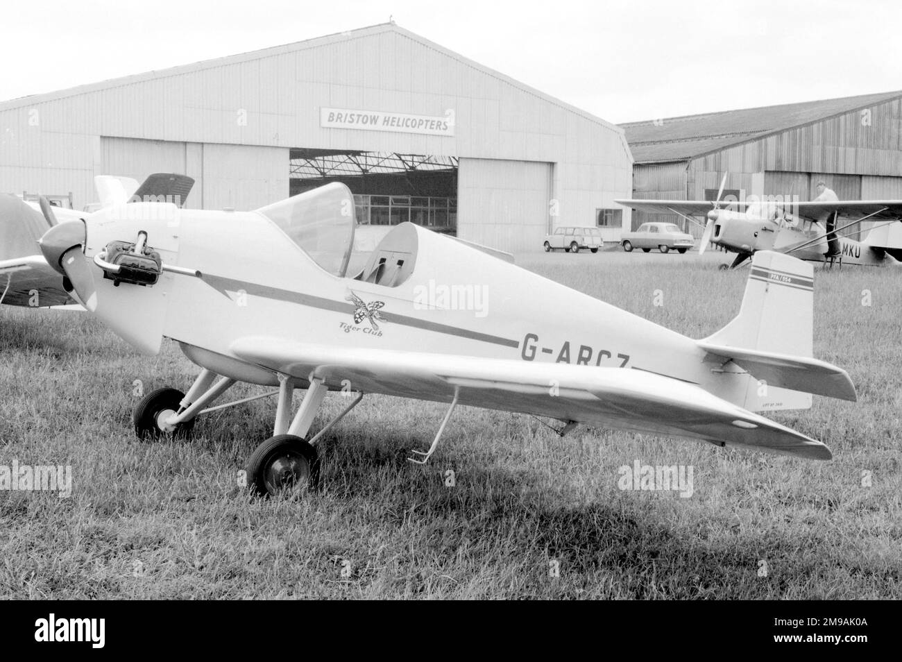 Druine D.31 Turbulent G-ARCZ, at Redhill aerodrome circa 1970. Written off (damaged beyond repair) on 1 June 1984 when crashed near Stapleford, Essex. After taking off from Runway 22 at Stapleford Aerodrome, Essex, the pilot noticed that, during the climb out, the Air Speed Indicator was fluctuating, and giving an indicated airspeed of between 50 and 65 knots. As a result, the pilot was not certain of his actual airspeed. Stock Photo
