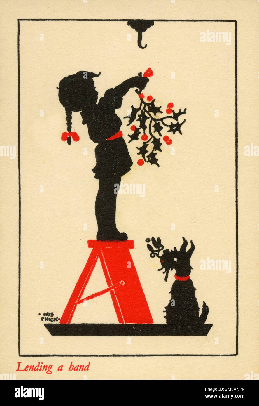 Greetings card design - Lending a hand. A little girl standing on a fold-out step to hang up the sprig of Christmas holly, whilst her pet black scottie dog stands attentively offering assistance. Stock Photo