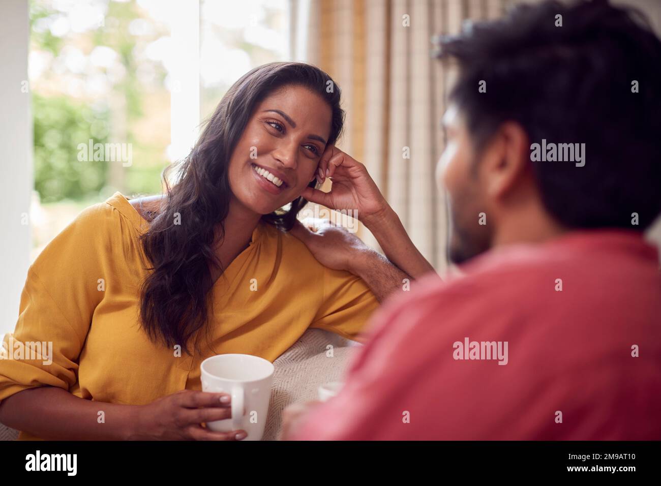 Indian male relaxing on sofa hi-res stock photography and images - Alamy
