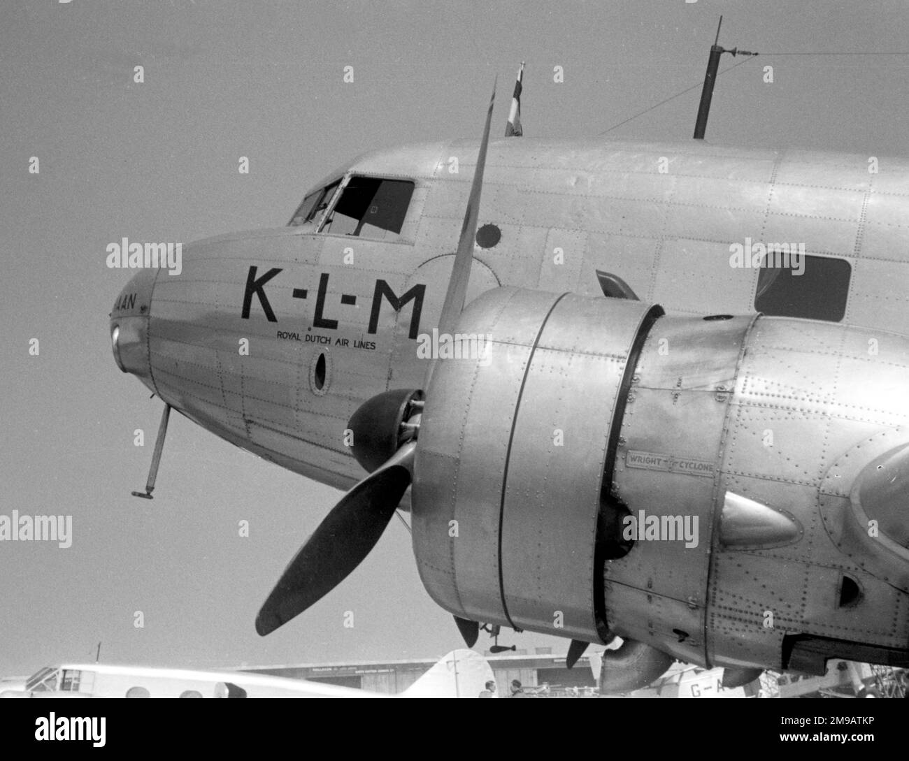 Douglas DC-2-115E PH-AKH 'Haan' (msn 1354.14), of KLM (Koninklijke Luchtvaart Maatschappij N.V. - Royal Aviation Company, Inc.) at Croydon Airport. A study of the port engine and nose, with one of the Imperial Airways Avro 652s in the background. Stock Photo