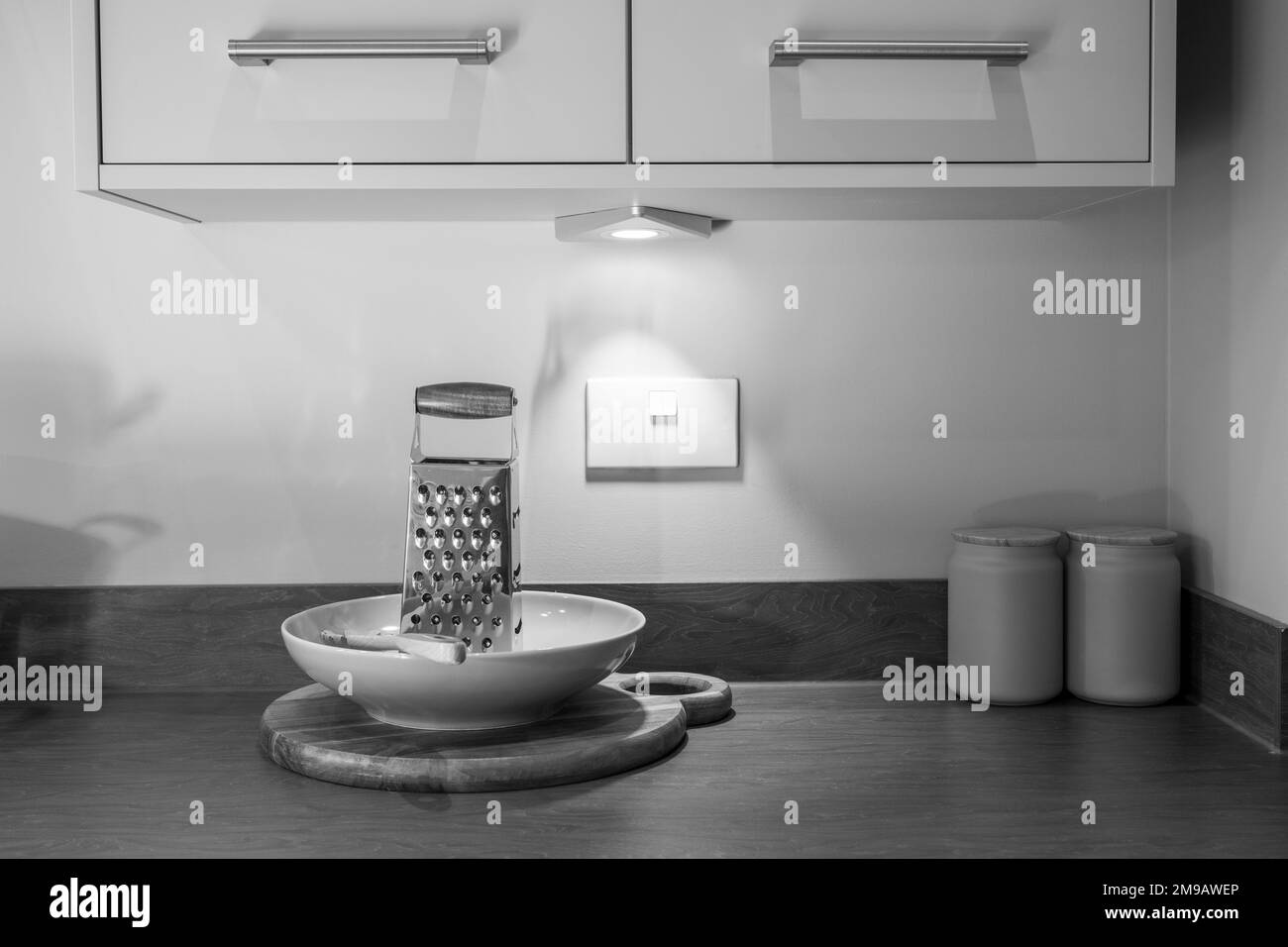vintage black and white kitchen lifestyle image with cheese grater