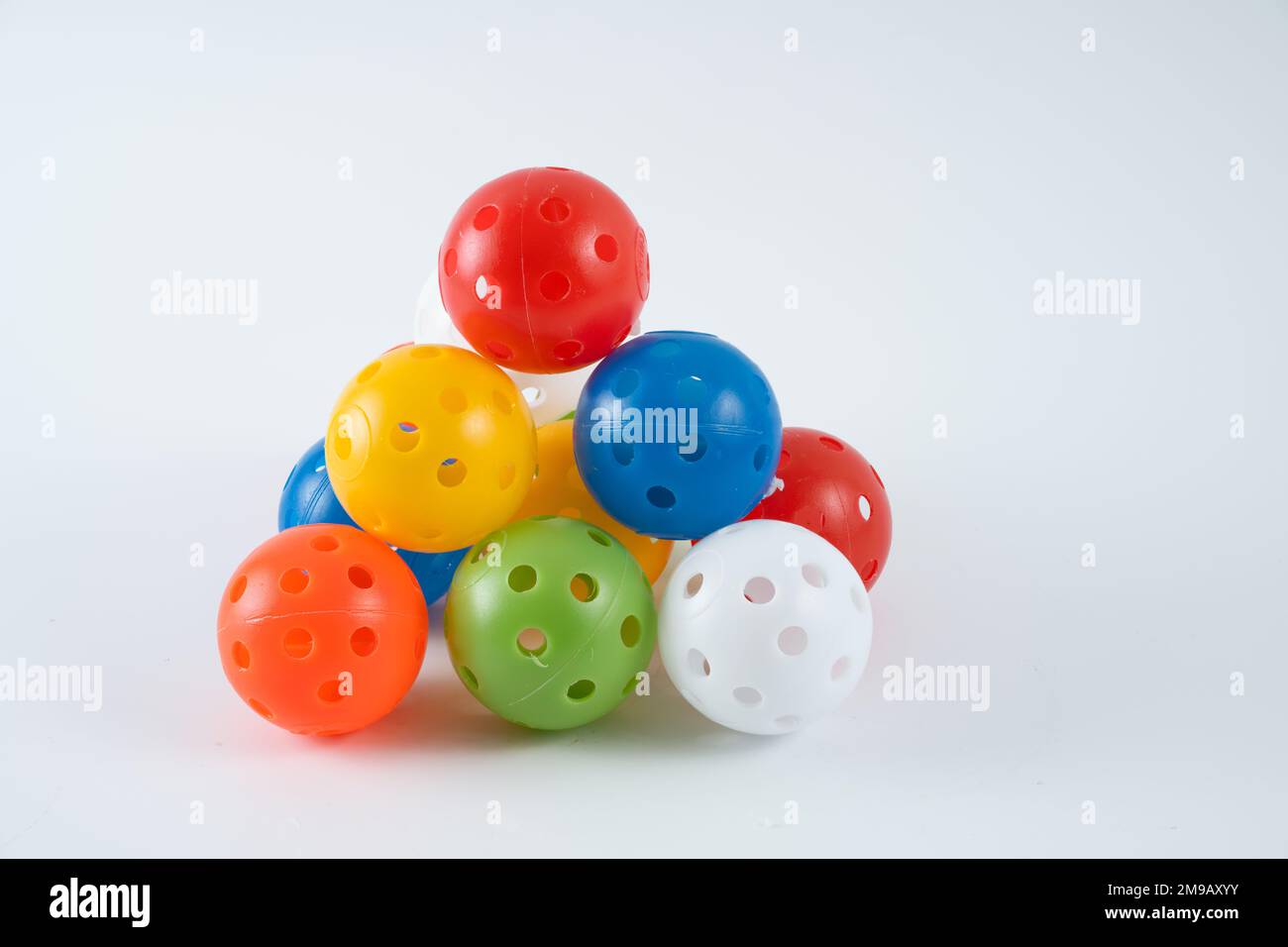 ndoor air flow golf practice balls multicoloured formed in a pyramid