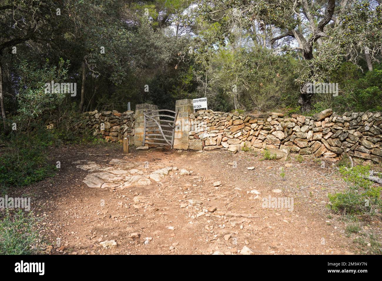 Cami de Valls, old wooden gate, hiking trails of Menorca, GR 223, Algaiarens, Balearic islands, Spain. Stock Photo
