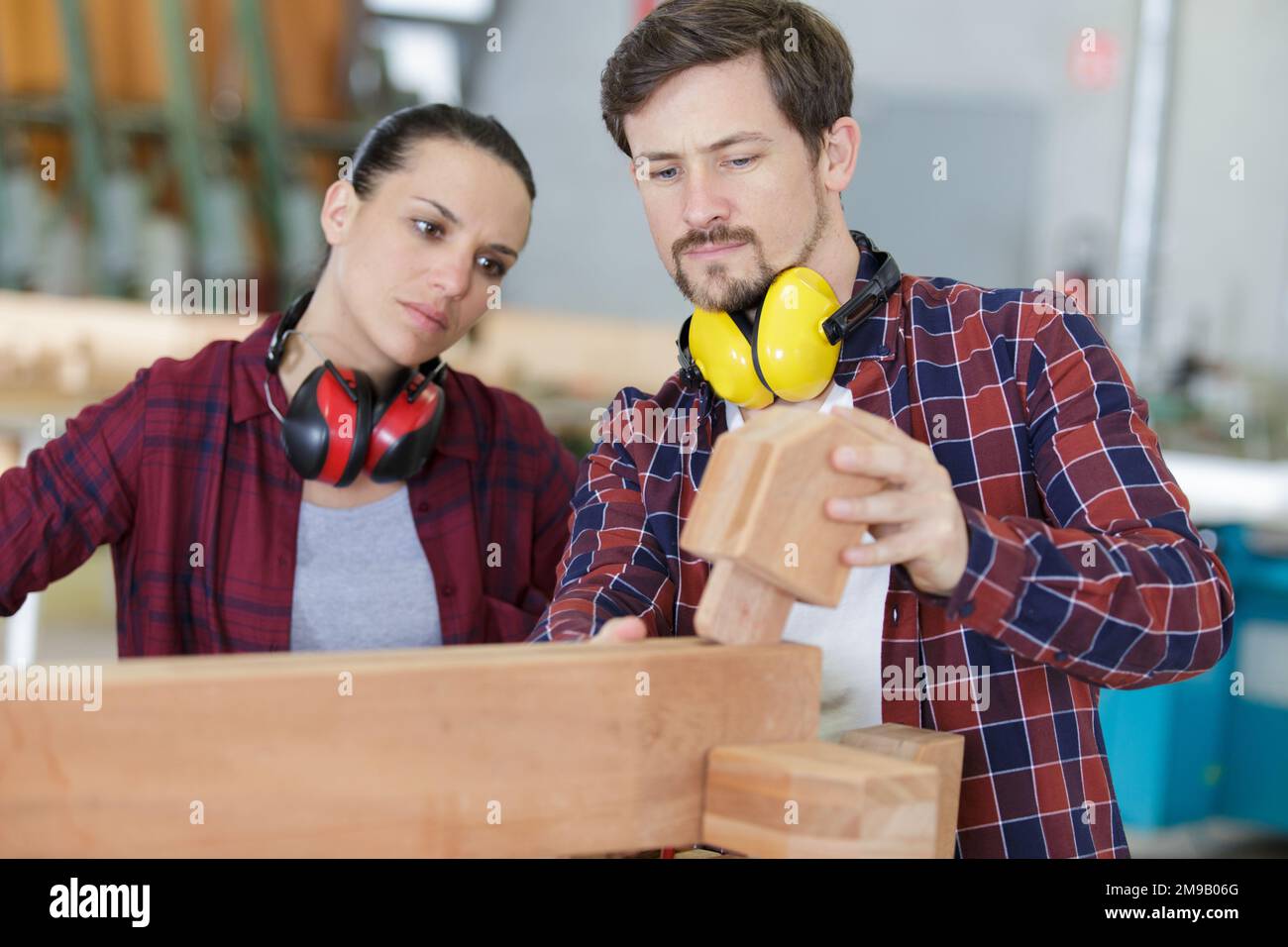 man and woman workers in carpentry workshop Stock Photo - Alamy