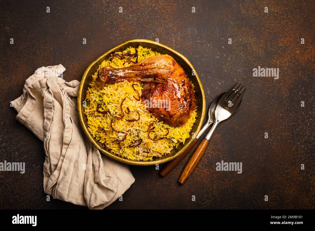 A metal balti bowl with chicken curry Stock Photo - Alamy