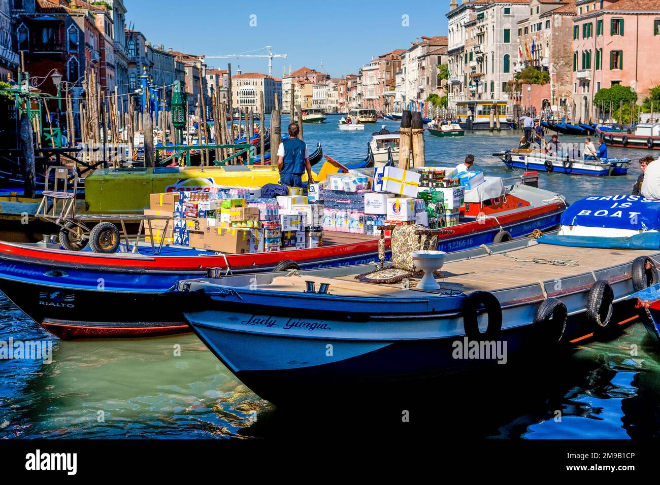 Supplies being delivered by boat in Venice, Italy on a very busy canal