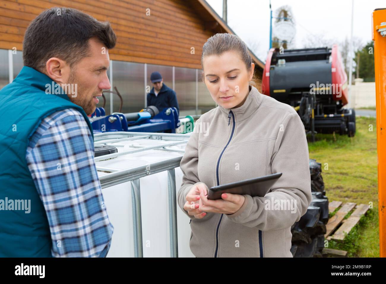 agricultural workers checking using digital tablet Stock Photo