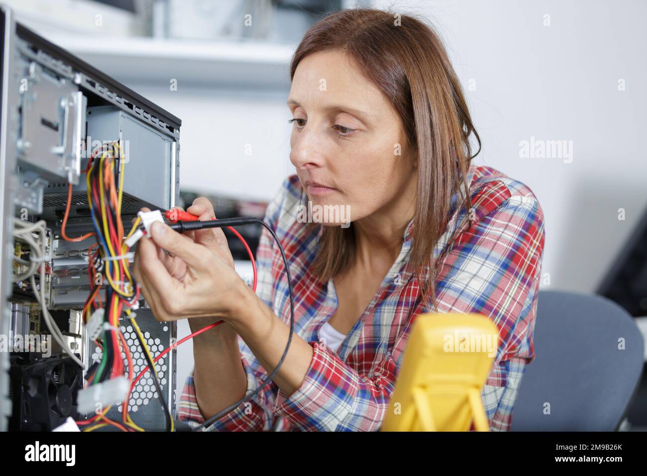 a computer repair voltage measuring Stock Photo Alamy