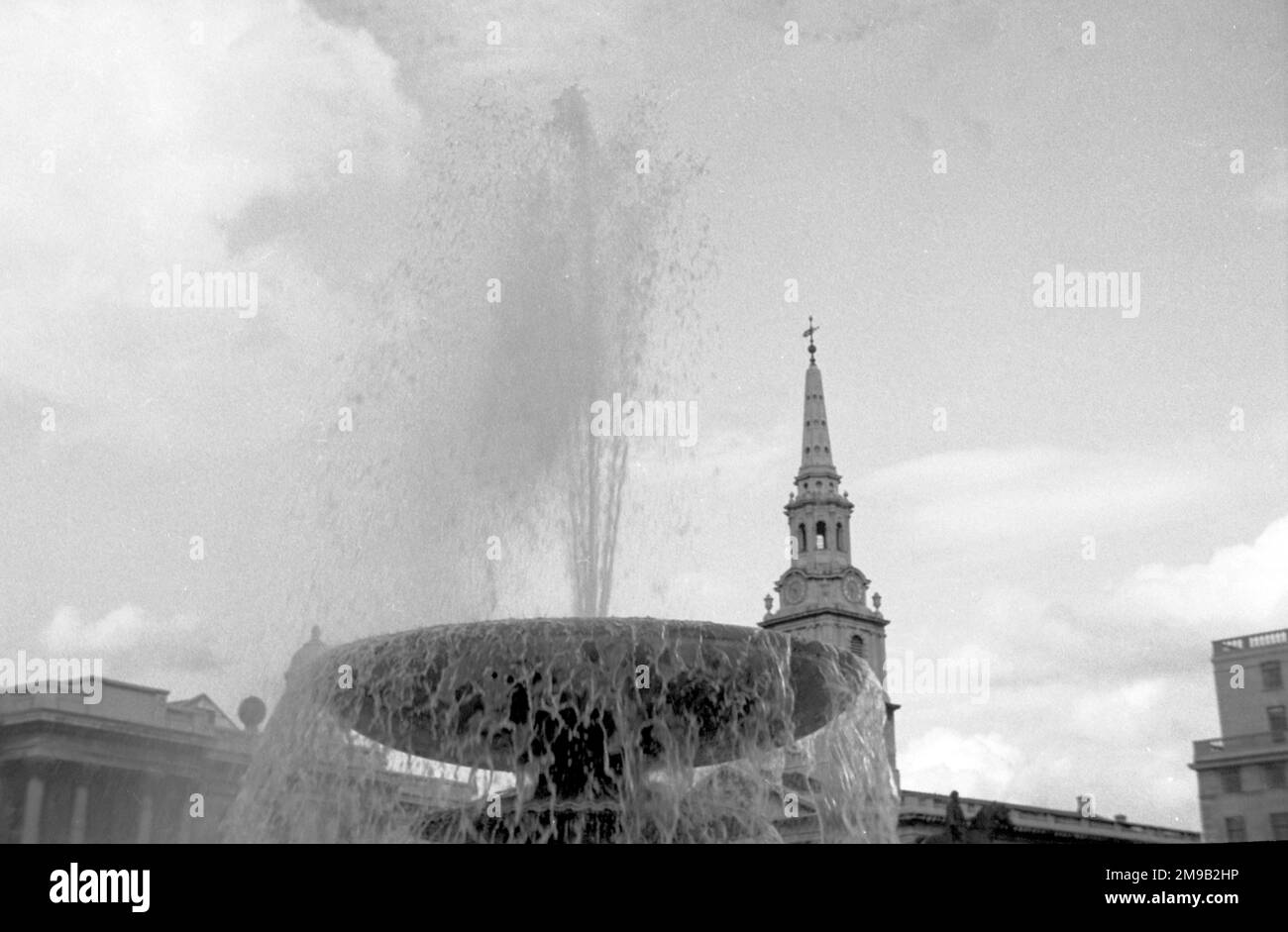 Trafalgar Square: The Eastern-most centre fountain, in fron to St. Martin-in-the-Fields Church. Stock Photo