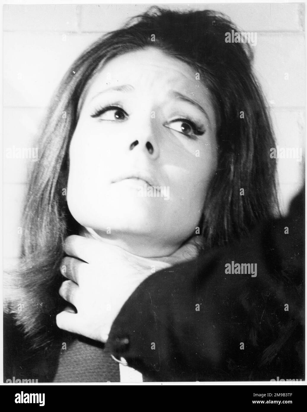Emma Peel in a pickle, from 'The Avengers' action TV series, (played by Diana Rigg and Patrick McNee). Stock Photo