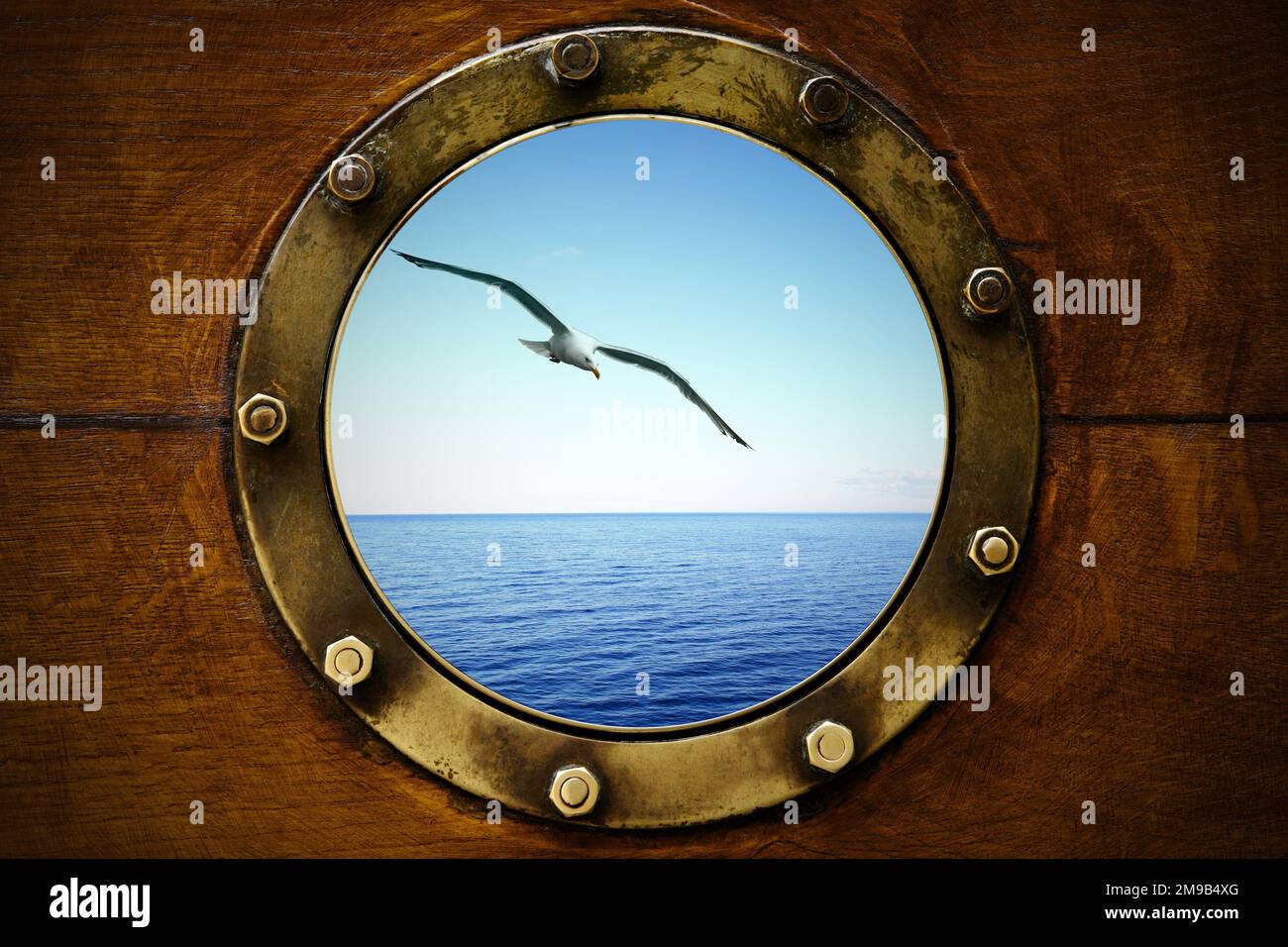 Beautiful seascape with sea gull through ship porthole Stock Photo Alamy