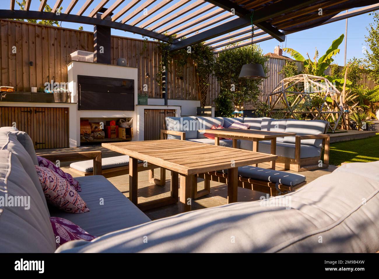 Outdoor Seating Area And Garden Of Modern House Stock Photo
