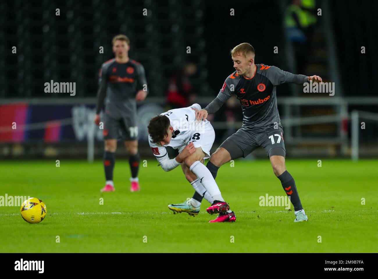 Swansea.com Stadium, Swansea, UK. 17th Jan, 2023. FA Cup Football, Swansea City versus Bristol City; Luke Cundle of Swansea City is tackled by Mark Sykes of Bristol City Credit: Action Plus Sports/Alamy Live News Stock Photo