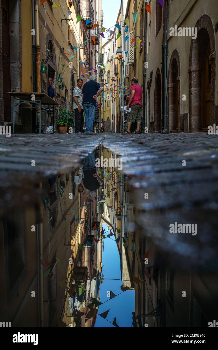 Reflection in a puddle in Bosa, Italy Stock Photo - Alamy