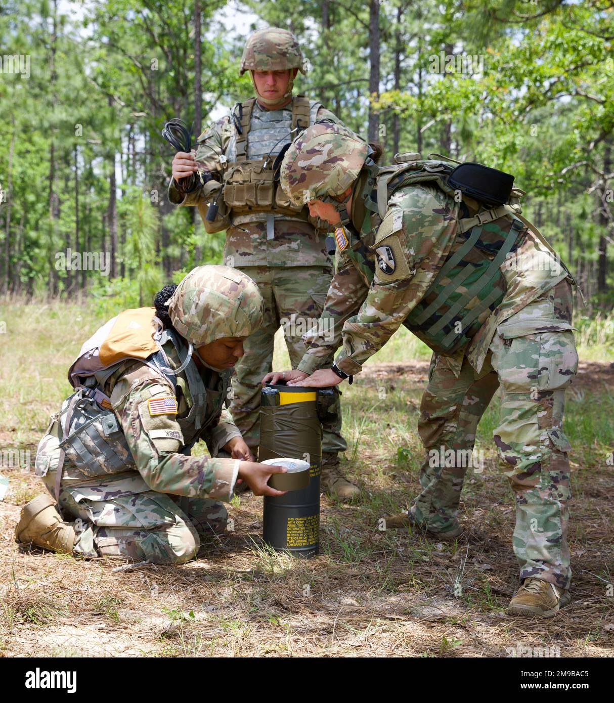 Soldiers with the 61st Troop Command secure explosives in the demolition site in Camp Shelby, Mississippi, May 15, 2022. Engineers conduct route clearance operations training to uncover improvised explosive devices in a controlled environment. Stock Photo