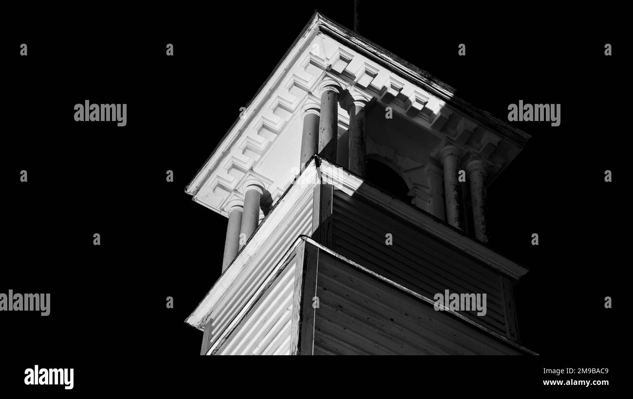 A low angle shot of the architectural tower under a dark night sky Stock Photo