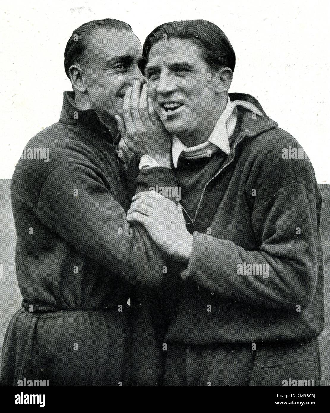 George Hunt and Ted Drake, Arsenal's centre-forwards in confidential conversation at Highbury Stock Photo