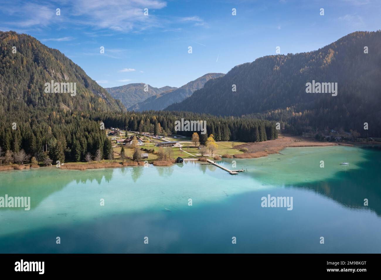 Lake Weißensee in Carinthia. Panorama aerial view of the East side of the idyllic lake during autumn. Stock Photo