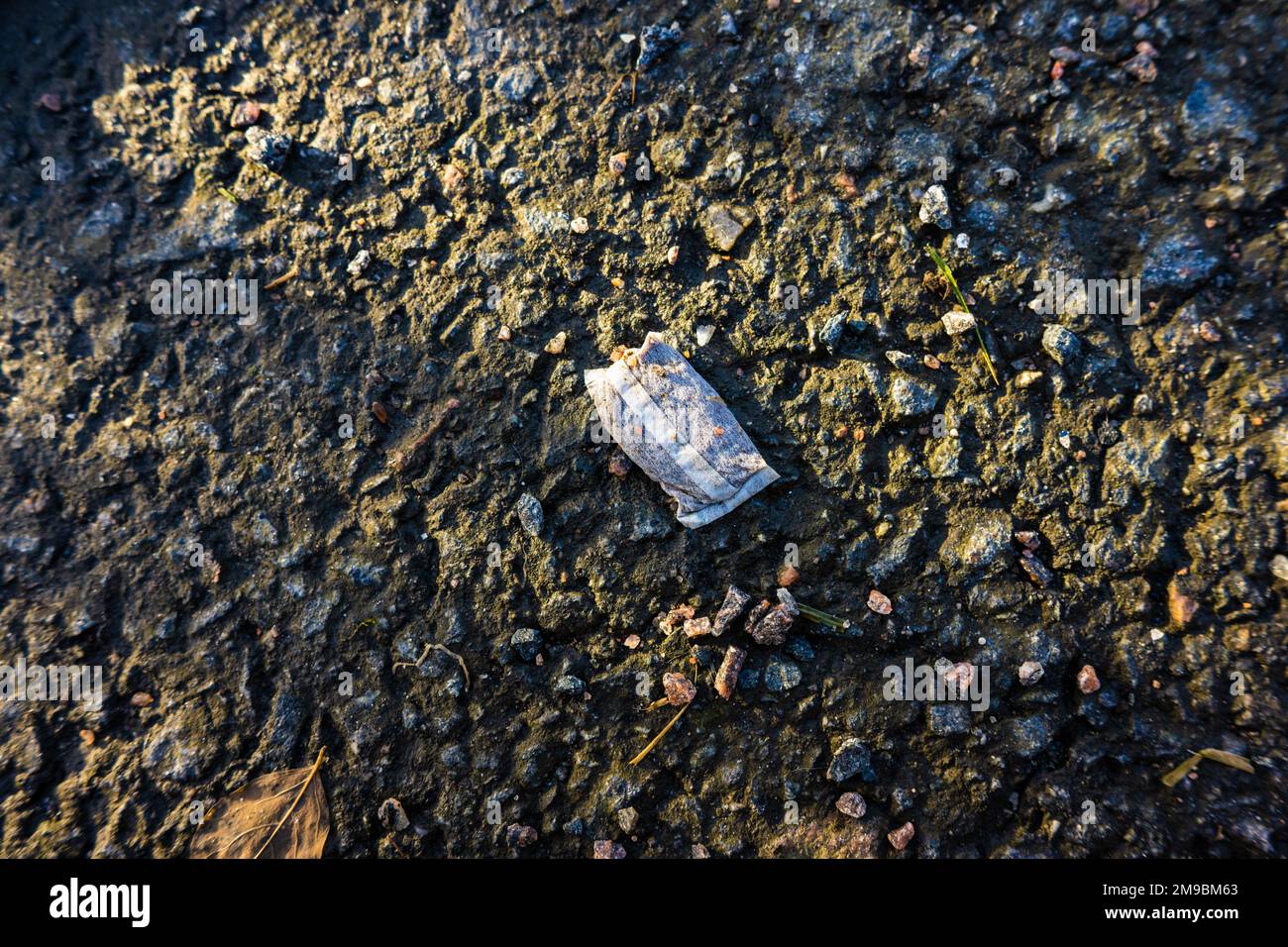 A snuff portion on asphalt Stock Photo