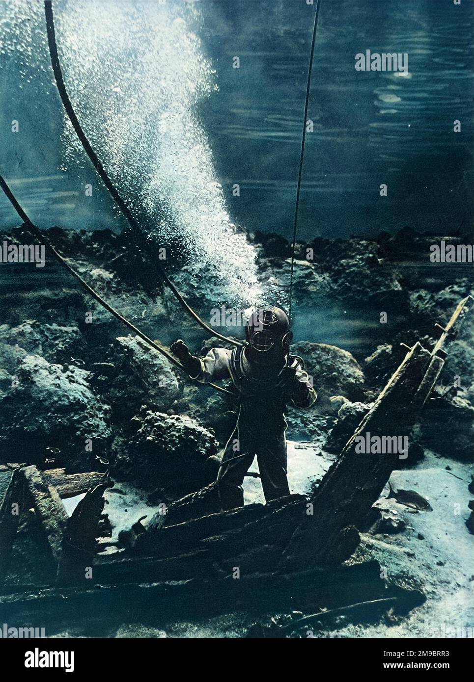 The first photograph of a diver at the bottom of the sea Stock Photo