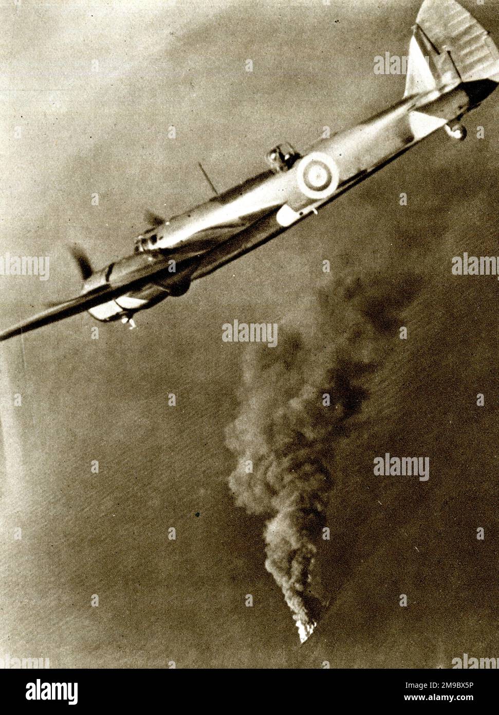 RAF bomber with German tanker on fire below Stock Photo