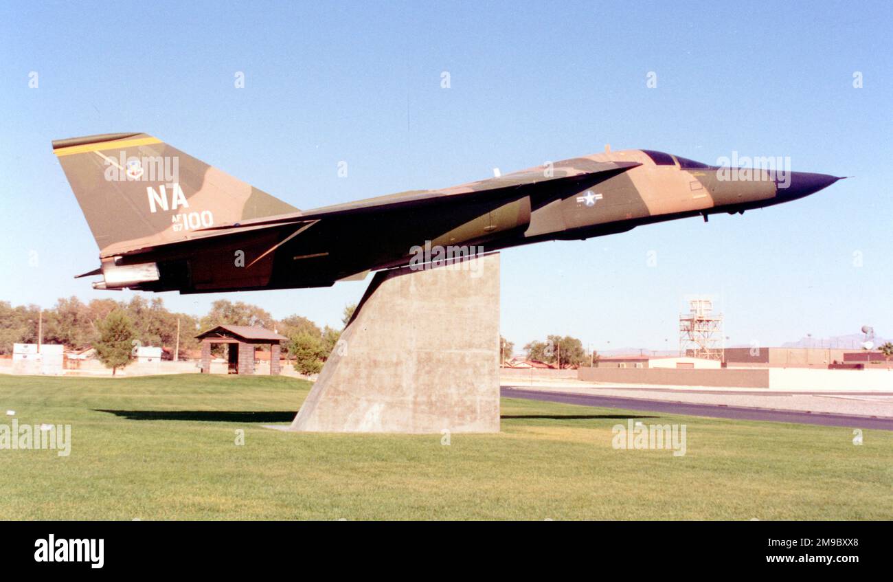 General Dynamics F-111A 67-0100 (MSN A1-145), mounted on a pylon at Freedom Park, Nellis AFB, Nevada, with F-5E 74-1571, F-100D 55-3595 and F-105F 63-8276. Stock Photo