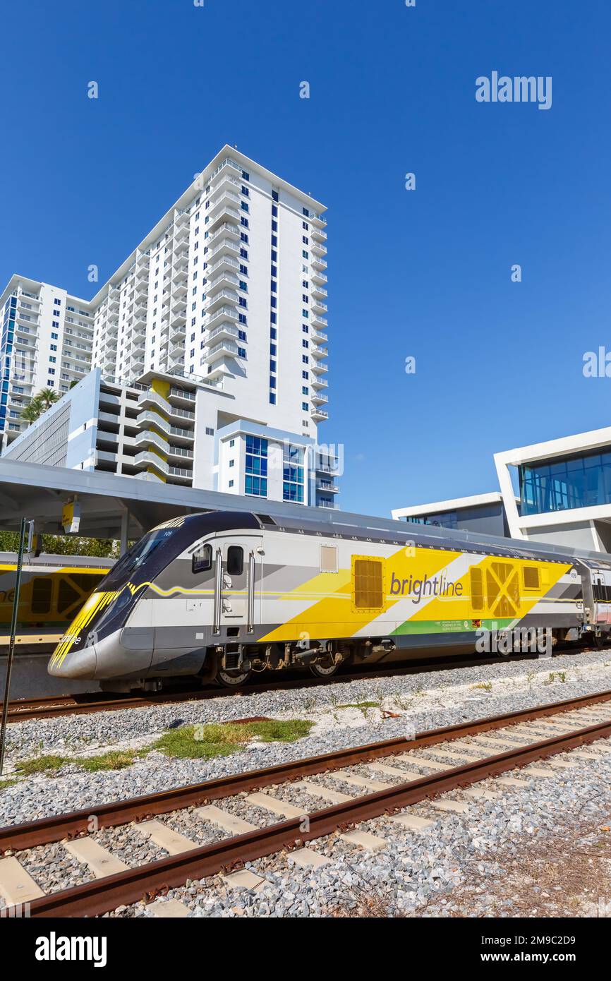 West Palm Beach, United States - November 14, 2022: Brightline private inter-city rail train at West Palm Beach railway station portrait format in Flo Stock Photo