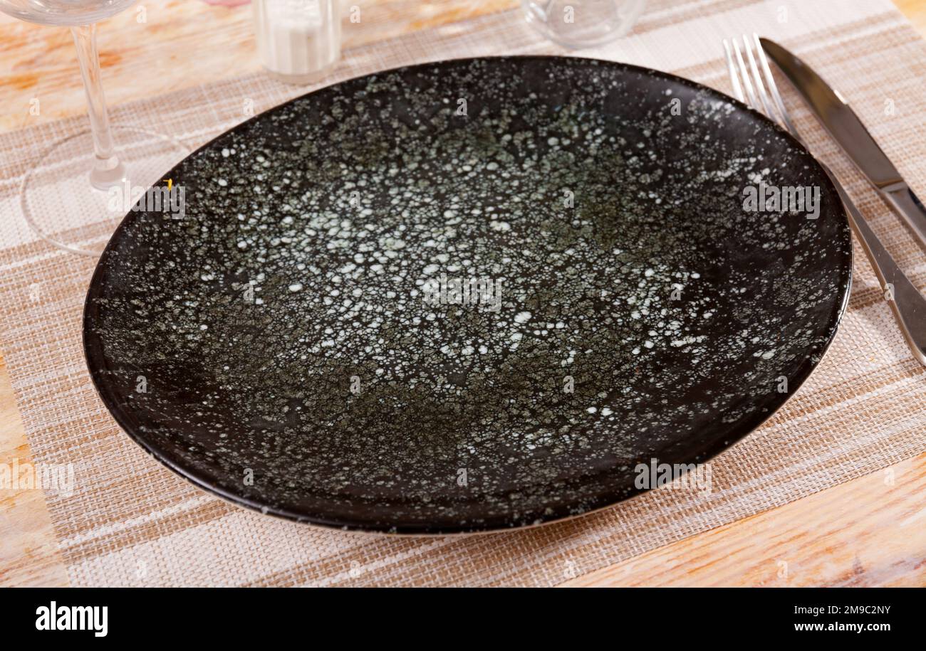 Empty plate, knife and fork served Stock Photo - Alamy