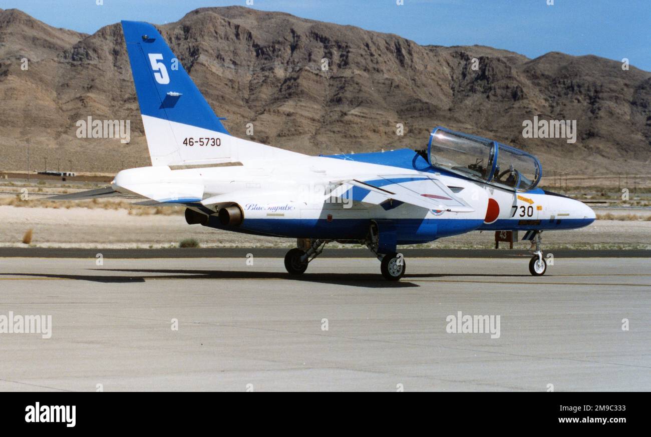 Japan Air Self Defence Force - Kawasaki T-4 46-5730 - no. 5 (msn 1130), of the Blue Impulse aerobatic display team, at the Nellis Air Force Base '50th Anniversary of the USAF' airshow on 26 April 1997. Stock Photo