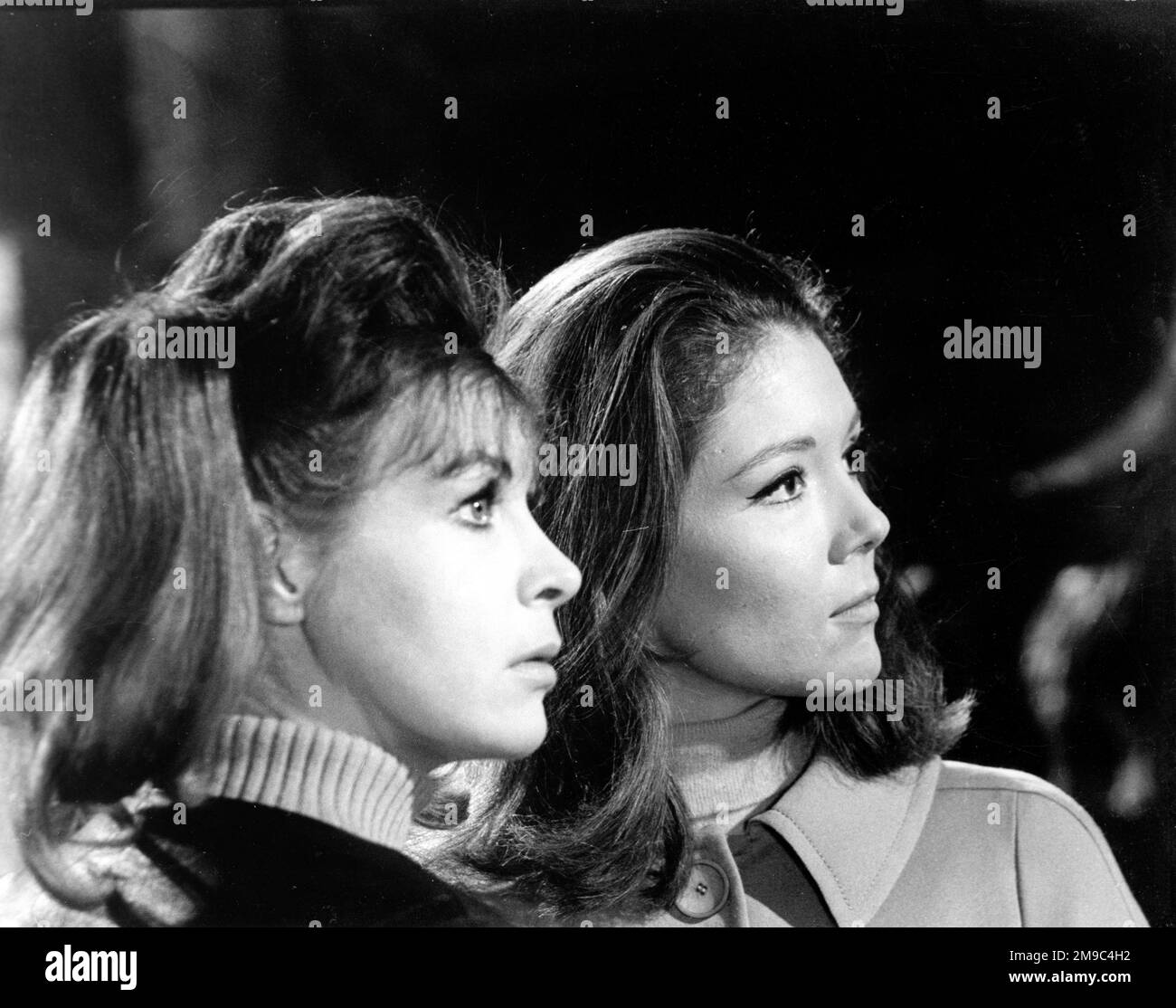Emma Peel with associate, during filming of 'The Avengers' Stock Photo