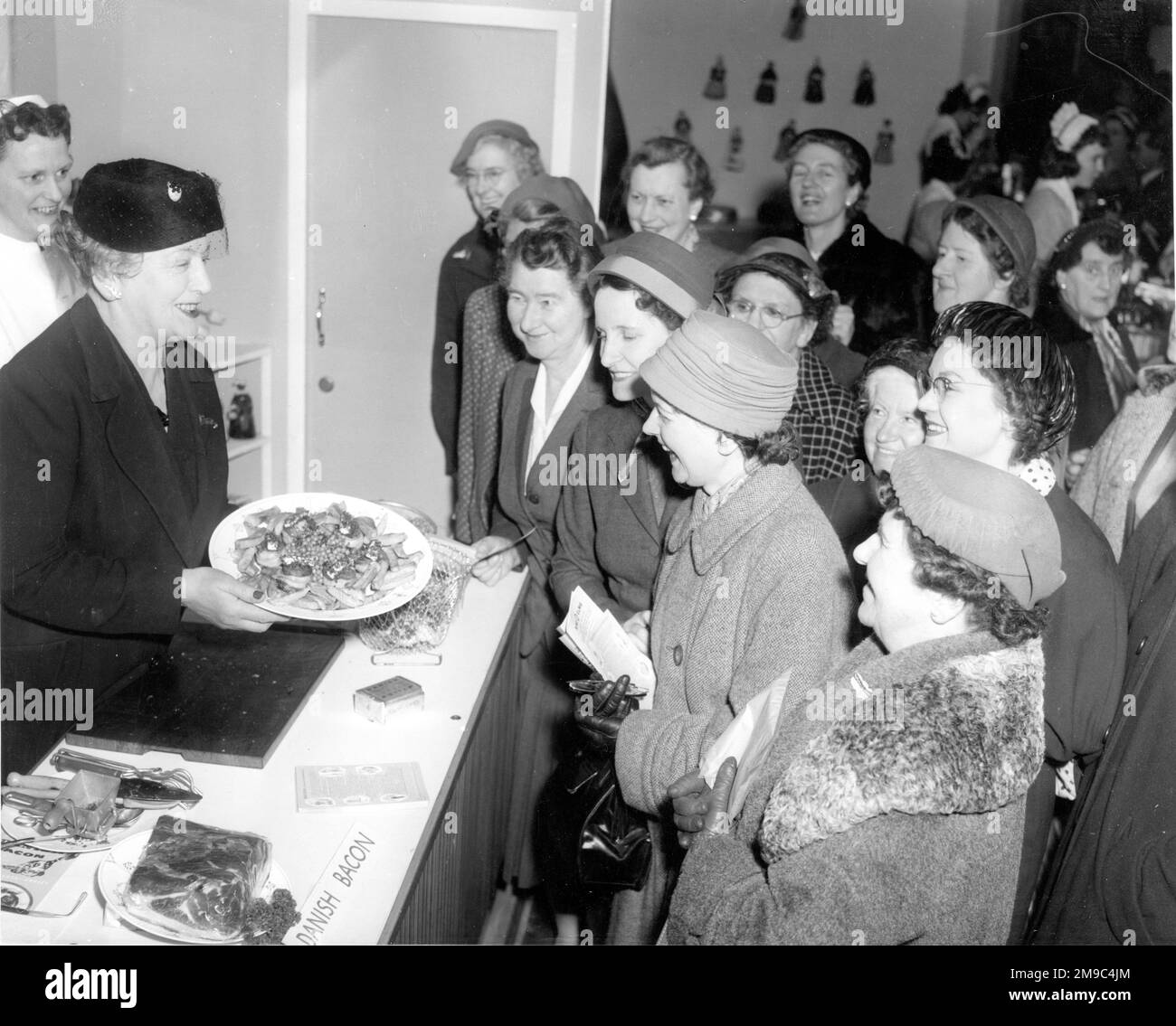 Ladies enjoying the food at a cookery demonstration. Stock Photo