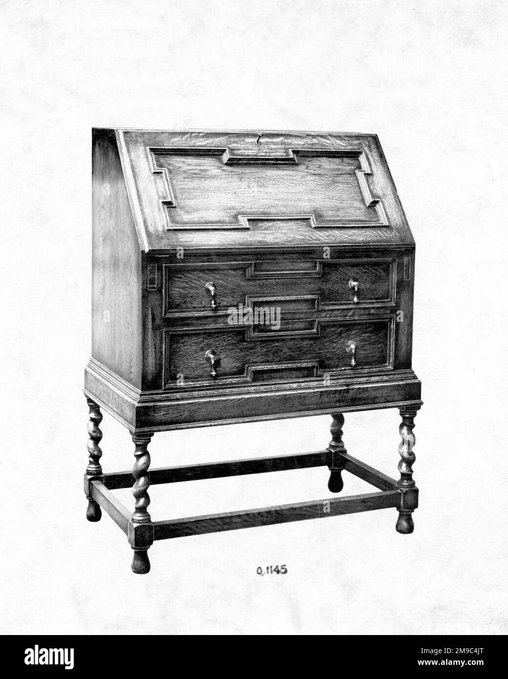 Jacobean style Oak Bureau in a furniture catalogue. Stock Photo
