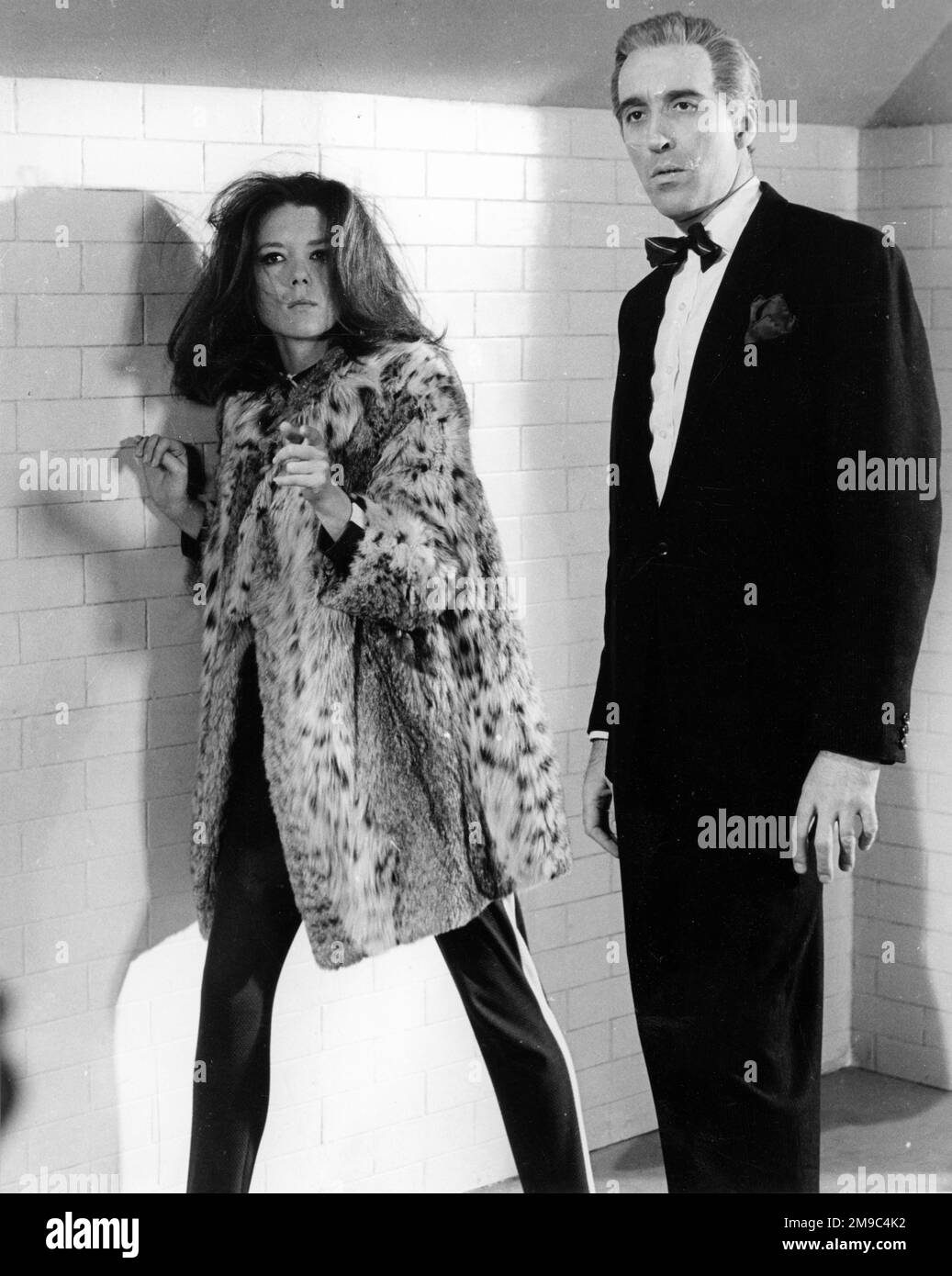 Emma Peel (played by Diana Rigg) with a male protagonist in 'The Avengers' TV series. Stock Photo