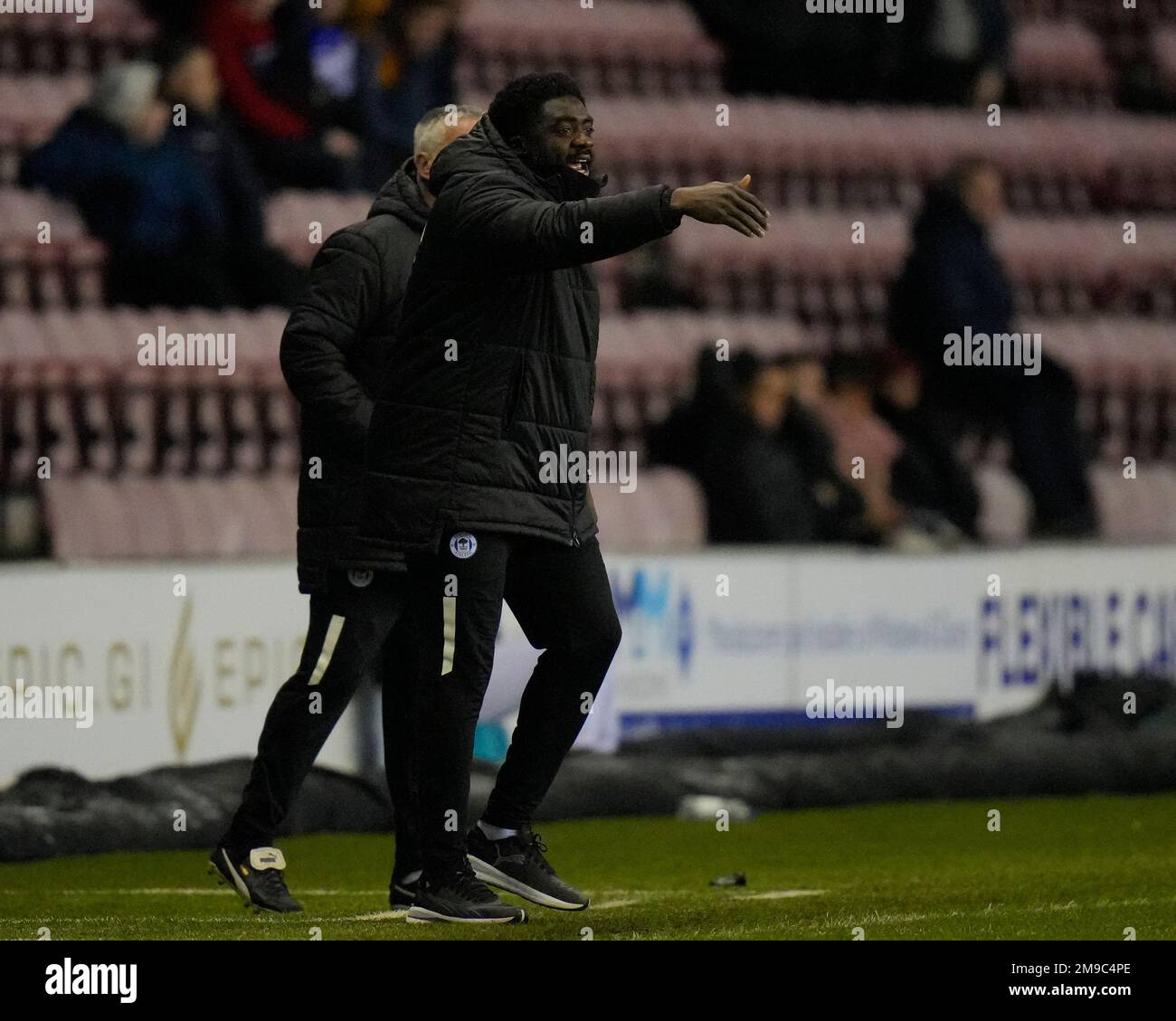 Wigan, UK. 17th Jan, 2023. Kolo Toure Manager of Wigan Athletic shouts instructions during the Emirates FA Cup match Third Round Replay Wigan Athletic vs Luton Town at DW Stadium, Wigan, United Kingdom, 17th January 2023 (Photo by Steve Flynn/News Images) in Wigan, United Kingdom on 1/17/2023. (Photo by Steve Flynn/News Images/Sipa USA) Credit: Sipa USA/Alamy Live News Stock Photo