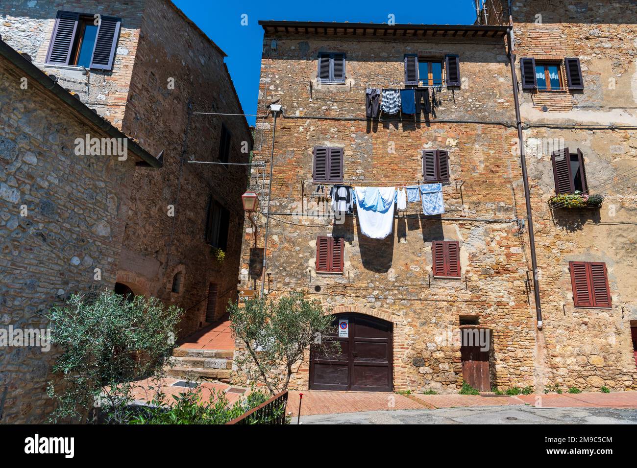 Drying cloth hanging on ropes between windows Stock Photo Alamy