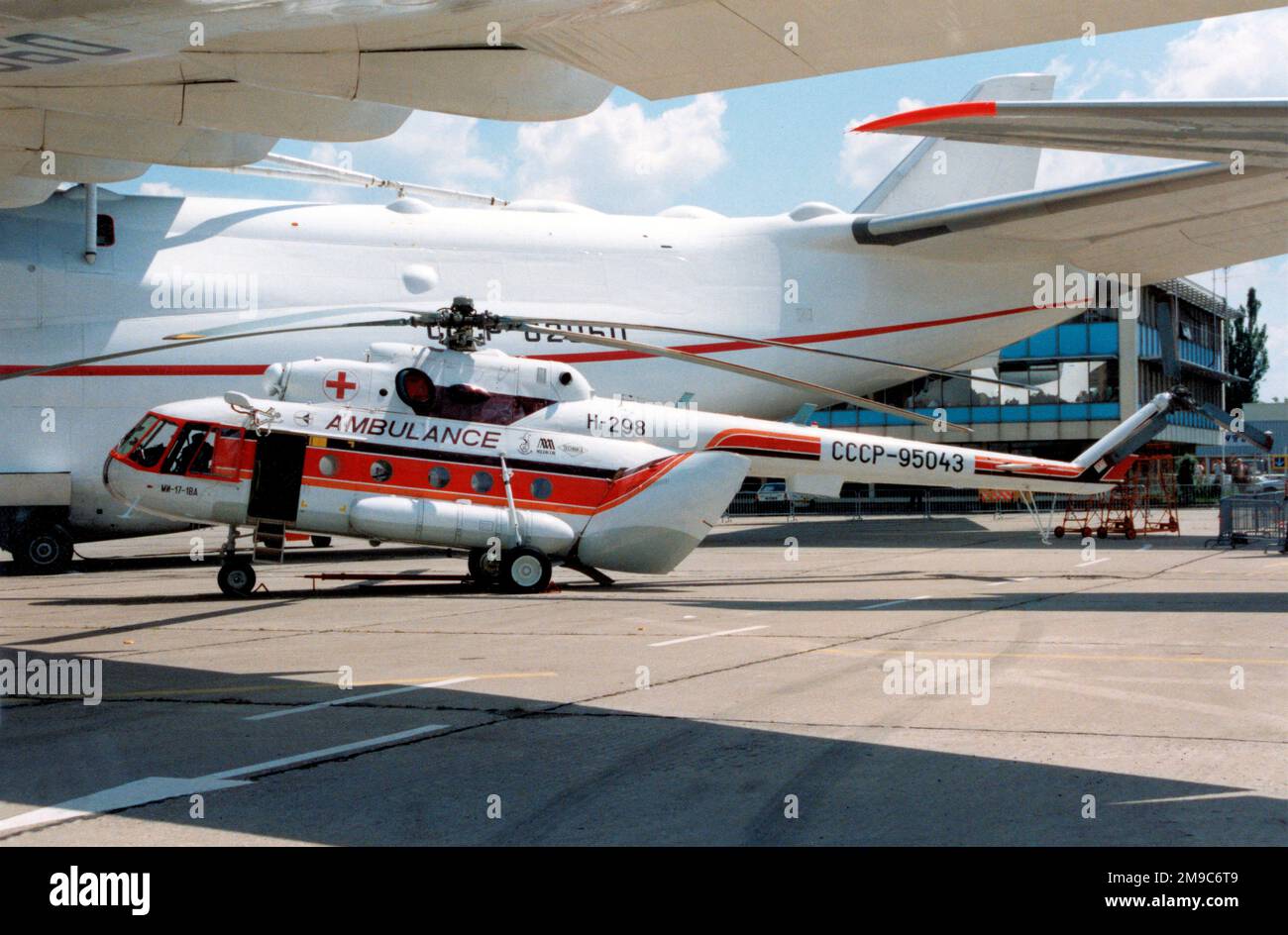 Mil Mi 17 1BA SSSR 95043 msn 95043 Sheltering Under The An 225 At mil-mi-17-1ba-sssr-95043-msn-95043-sheltering-under-the-an-225-at