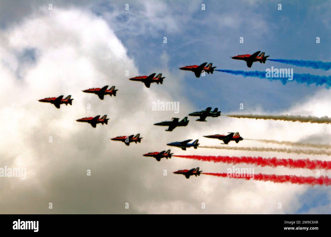 The Red Arrows 50th Anniversary Flypast with Leader of the Patrouille Suisse, Breitling Jet Team, Patrouille de France and Frecce Tricolori at the Royal International Air Tattoo 2014 Stock Photo