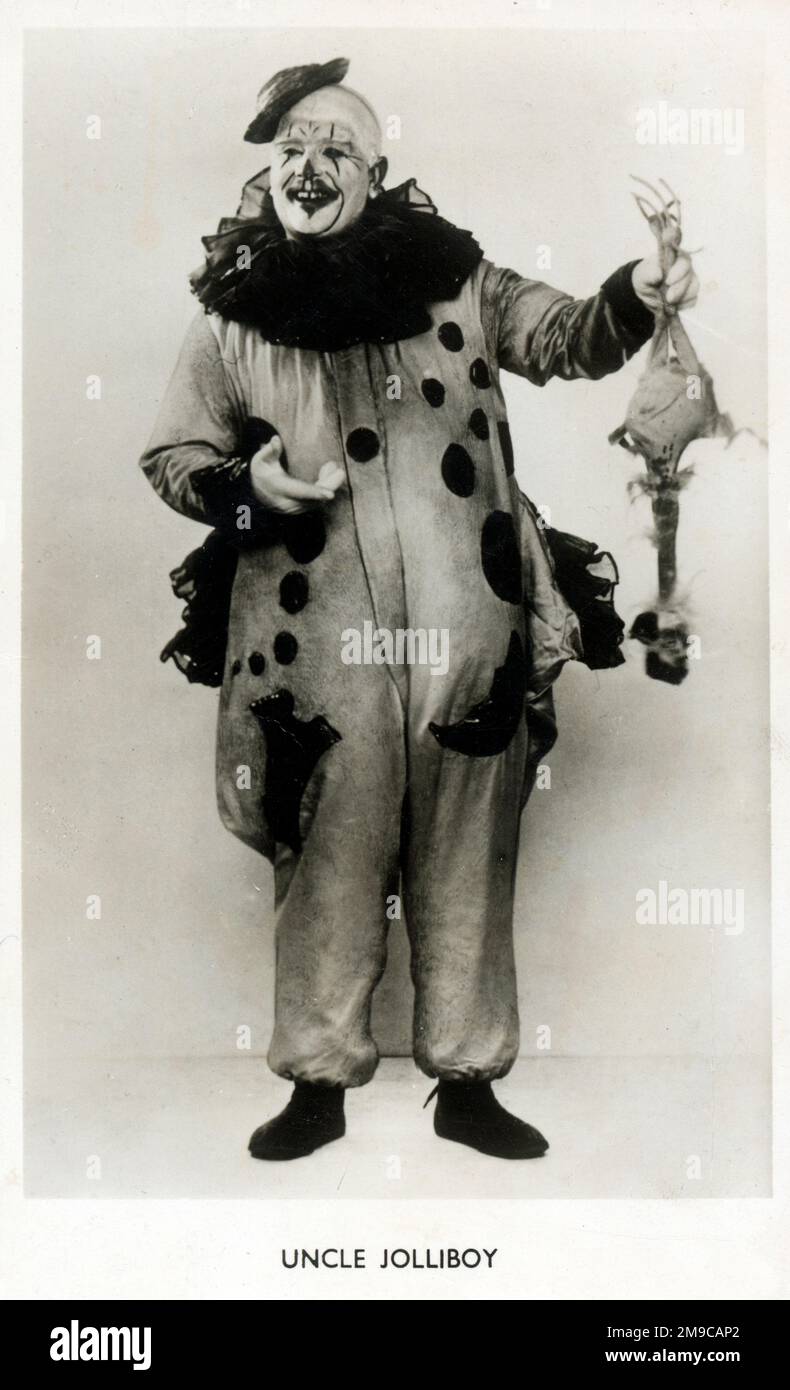 Clown Uncle Jolliboy - holding up a fake chicken Stock Photo