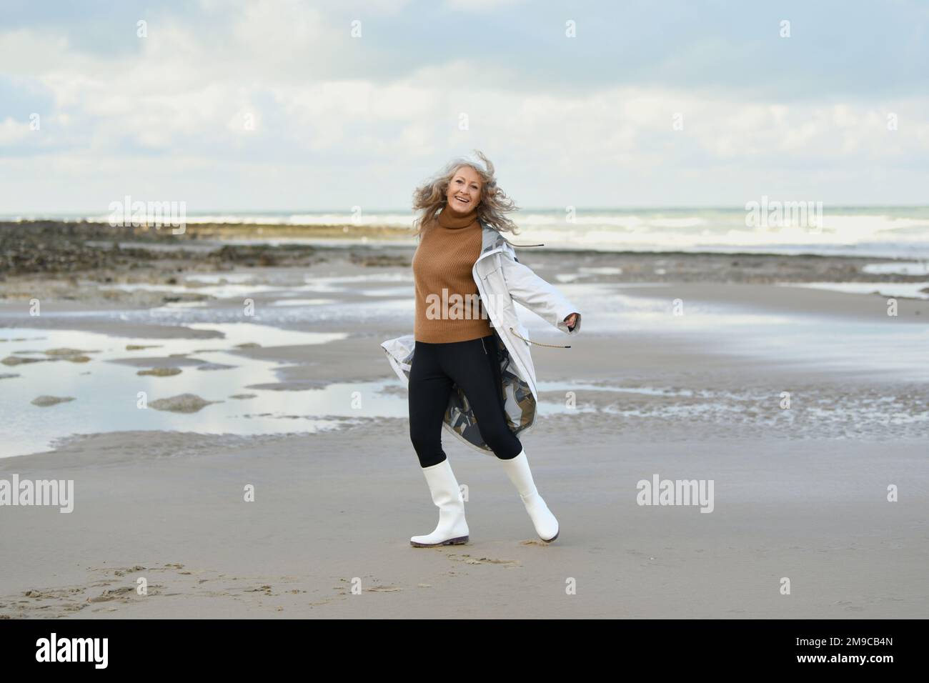 Portrait of a fifty-year-old woman with a white smile Stock Photo