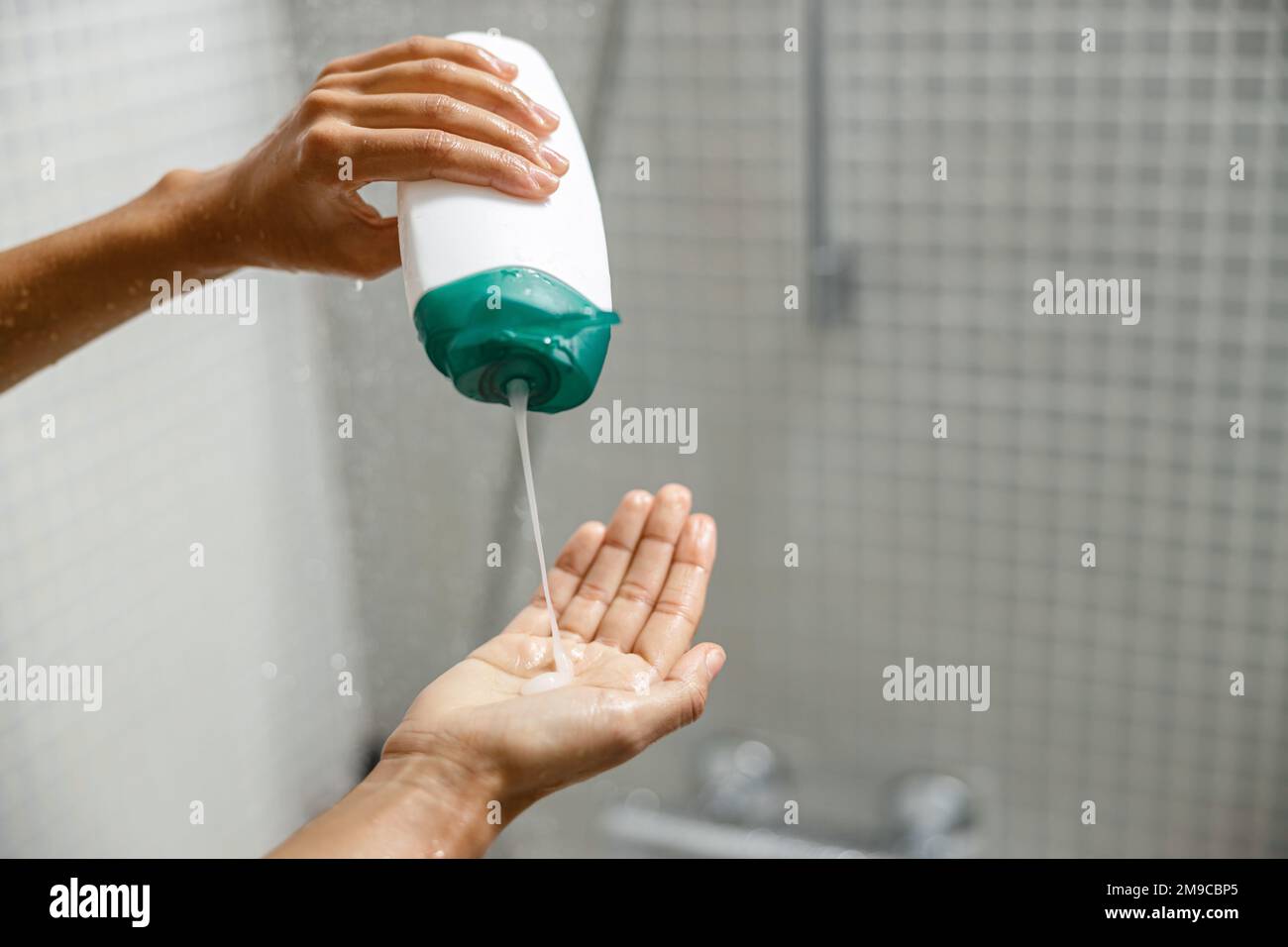 Woman pouring shower gel on her hand when taking shower. Hygiene concept Stock Photo Alamy