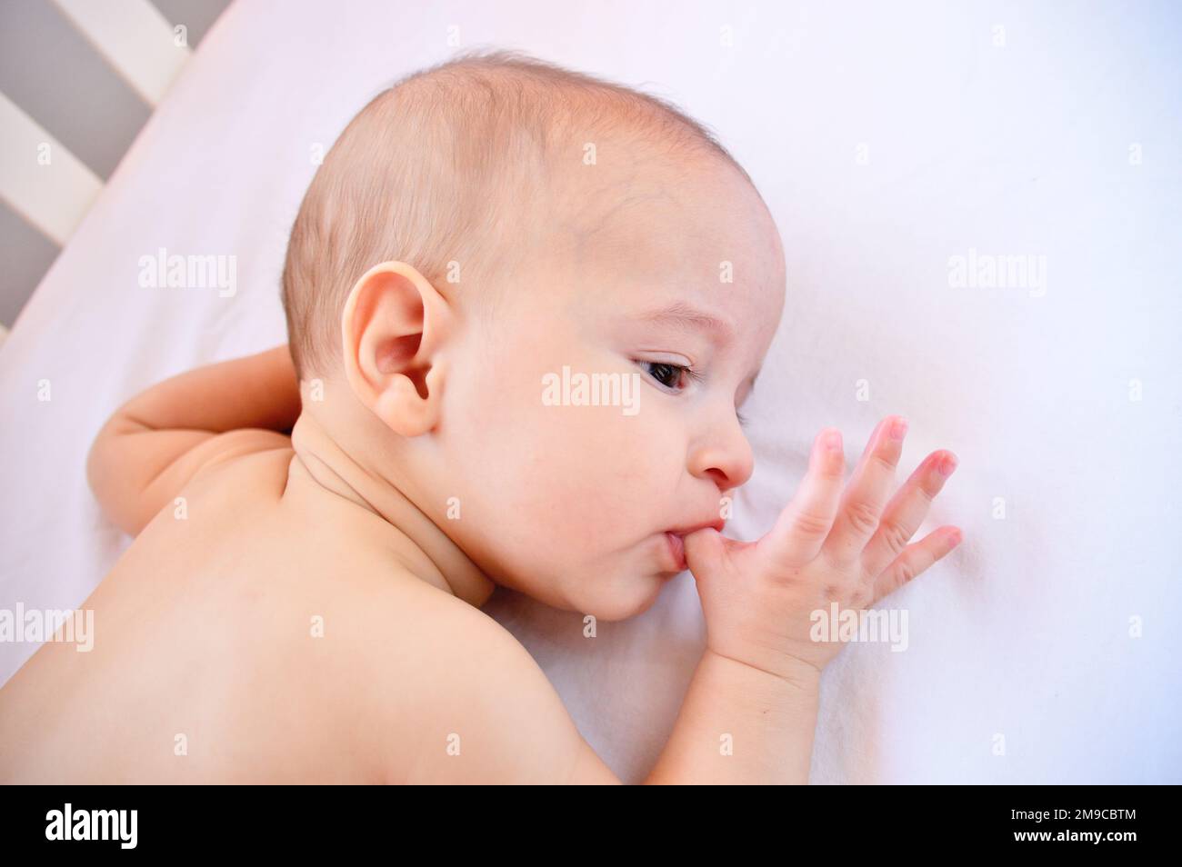 Cropped shot of an adorable baby boy taking a nap Stock Photo