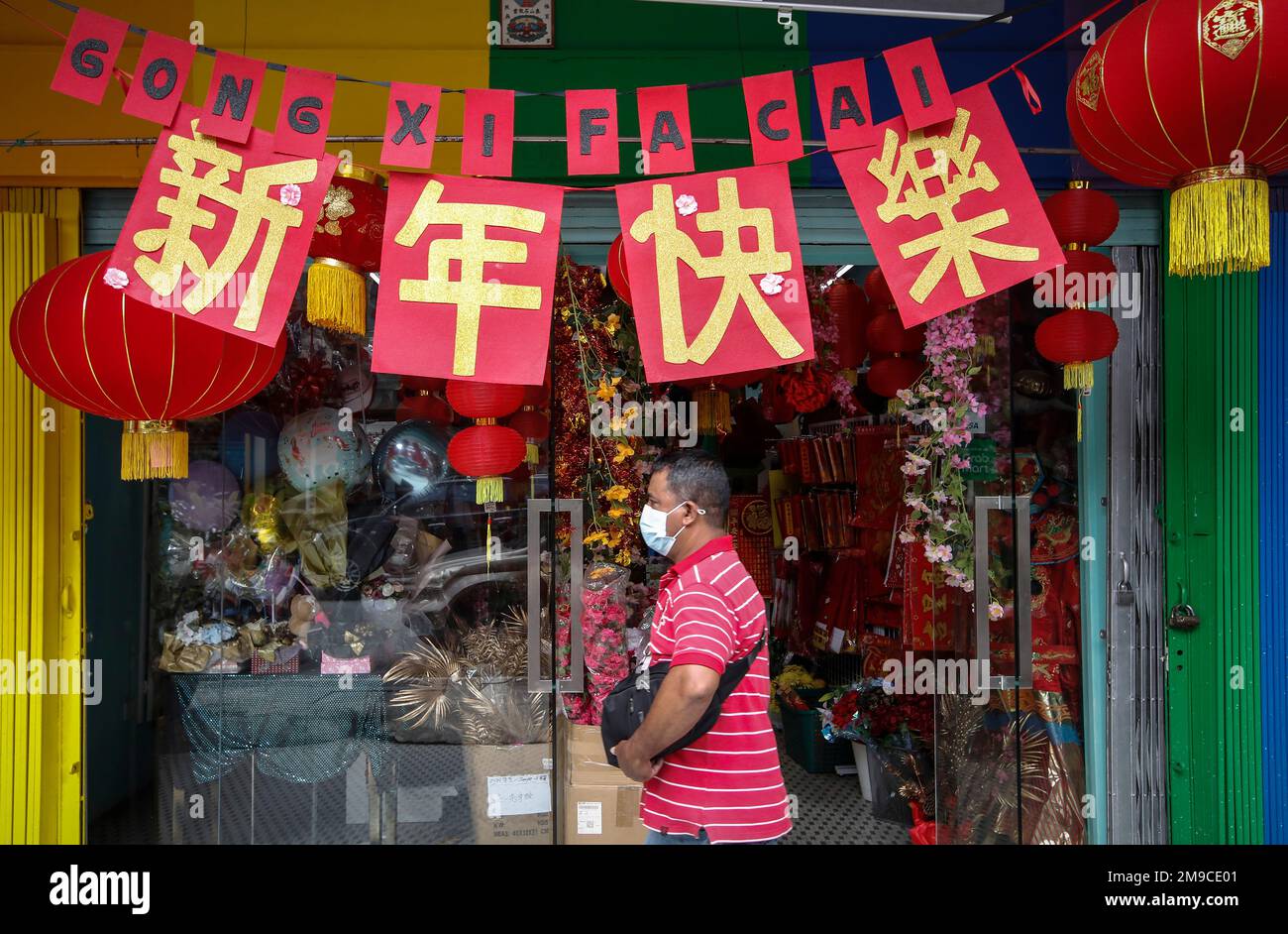 Kuala Lumpur, Malaysia. 17th Jan, 2023. A man walks past a shop selling  decorations near China town district ahead of the Lunar New Year of the  Rabbit. Lunar New Year which falls
