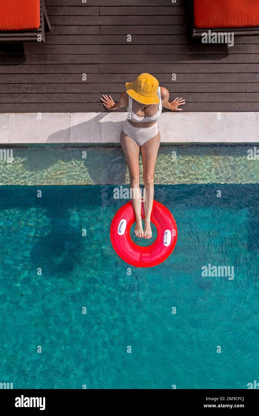 Aerial view of woman in swimming pool Stock Photo - Alamy