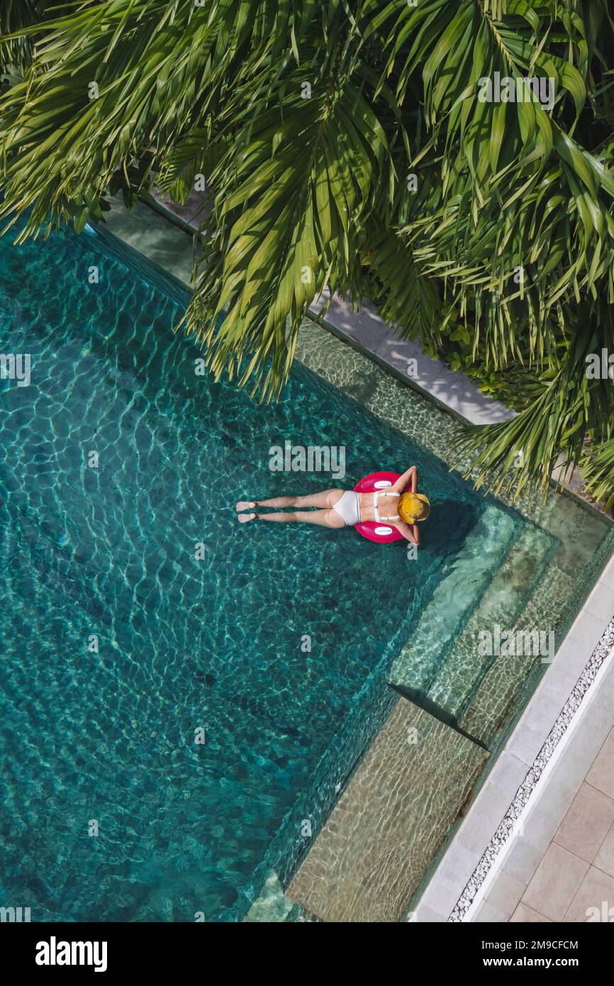 Aerial view of woman in swimming pool Stock Photo - Alamy
