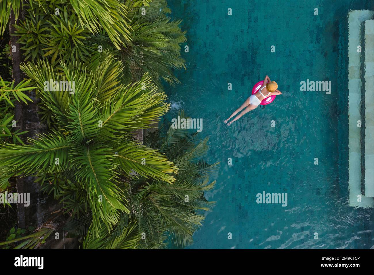 Aerial view of woman in swimming pool Stock Photo - Alamy