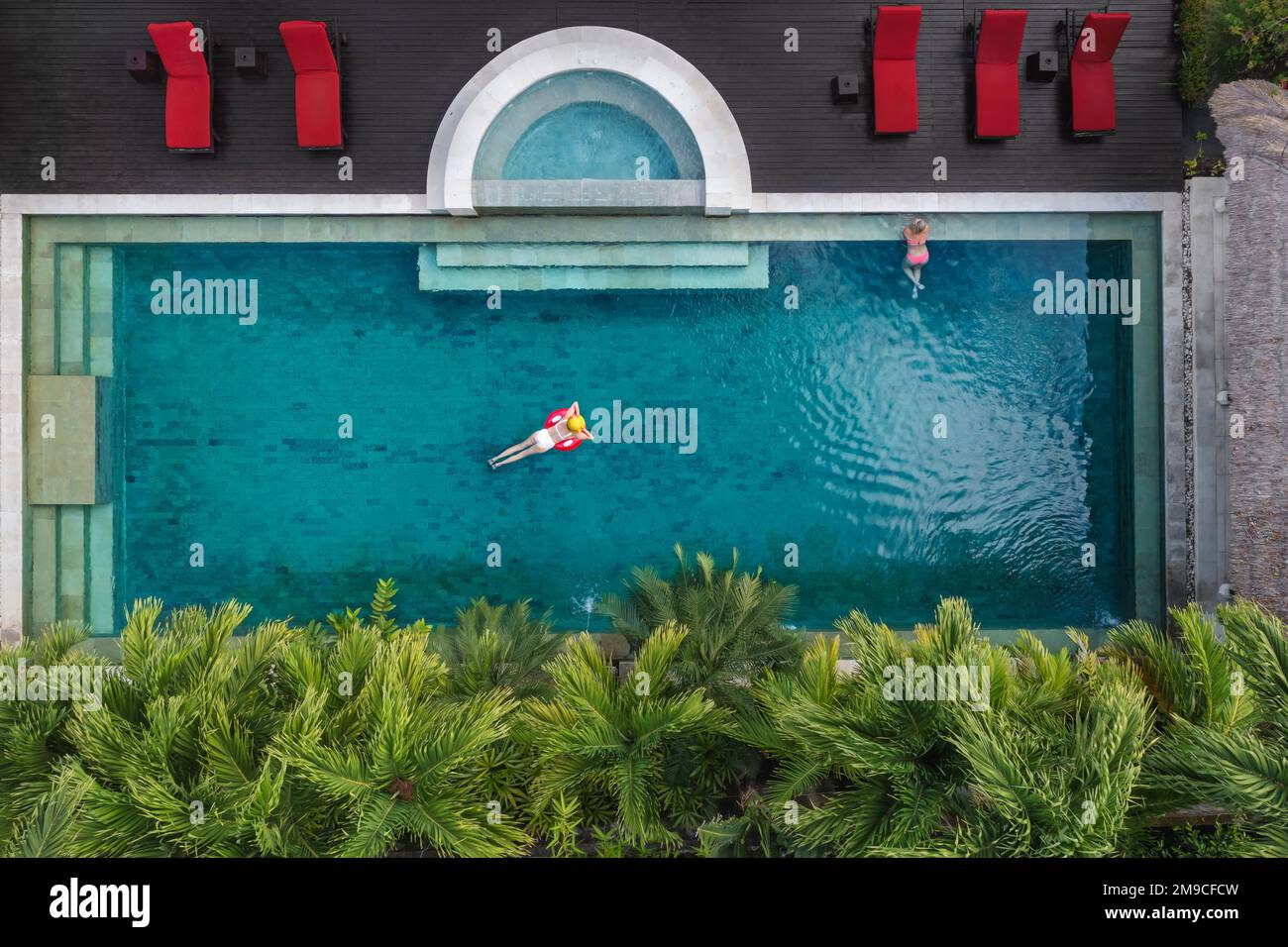 Aerial view of women in swimming pool Stock Photo - Alamy