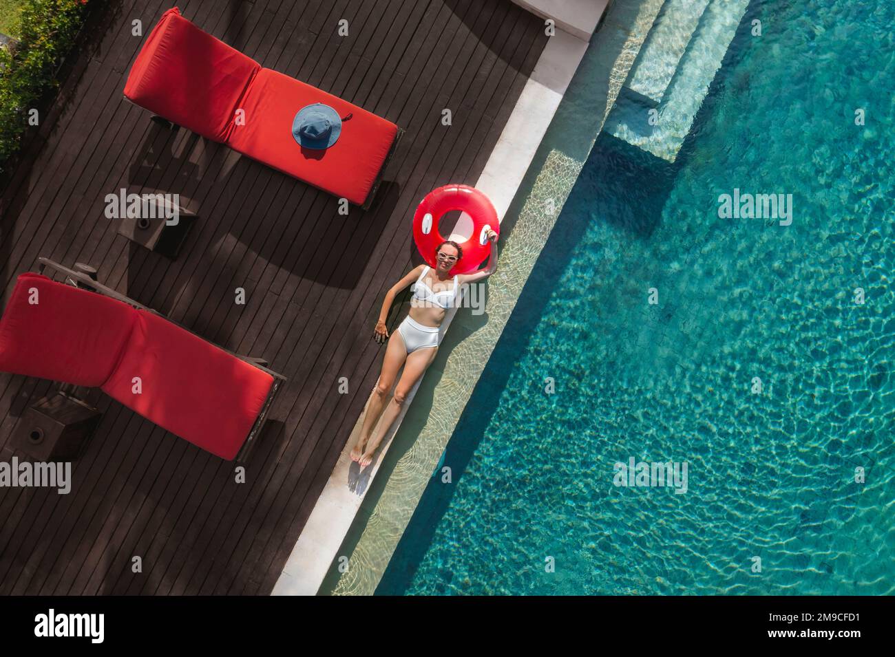 Aerial view of woman in swimming pool Stock Photo - Alamy