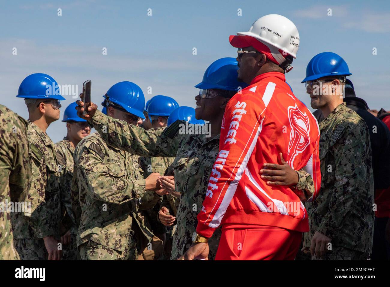 NORFOLK (May 16, 2022) – WWE wrestlers tag-team Street Profits take pictures with U.S. Navy Sailors, May 16. WWE visited the USS Iwo Jima as part of a Navy Entertainment outreach effort prior to their Monday Night Raw event at the Scope Arena in Norfolk, Virginia. Stock Photo