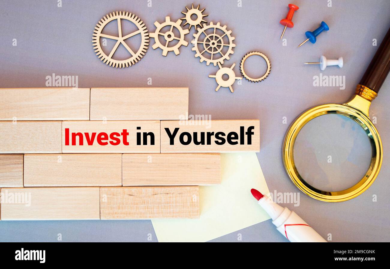 Invest in yourself. Note book with text. Self improvement concept. Stock Photo